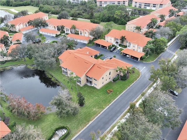 drone / aerial view with a water view