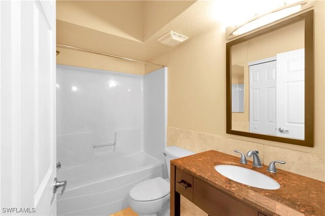 full bathroom featuring vanity, toilet, and shower / bath combination