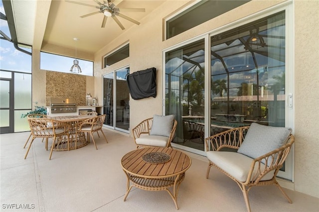 view of patio / terrace with ceiling fan, grilling area, a lanai, exterior kitchen, and outdoor dining space