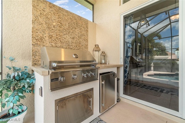 view of patio with exterior kitchen and grilling area