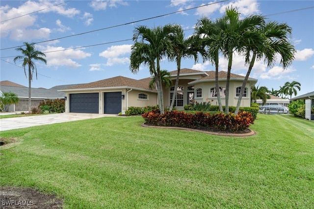 ranch-style home featuring concrete driveway, an attached garage, a front lawn, and stucco siding