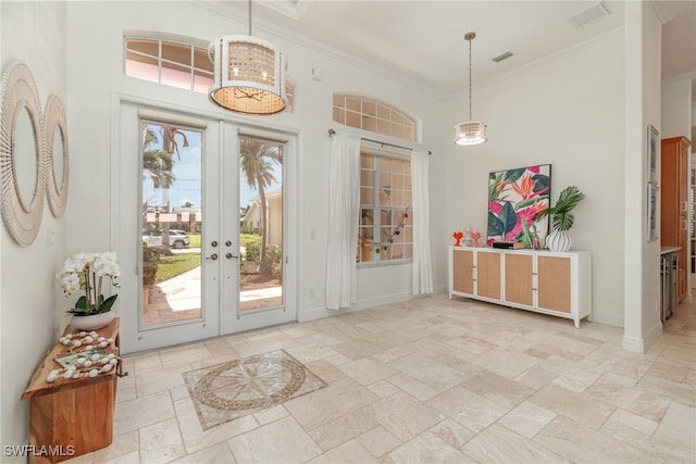 doorway featuring visible vents, baseboards, french doors, stone tile flooring, and crown molding