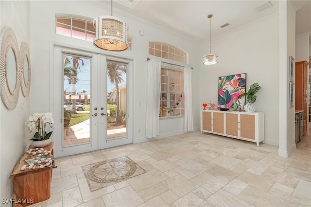 1435 SW 53rd Ln, Cape Coral, FL 33914 - entryway featuring stone tile flooring, ornamental molding, and a towering ceiling