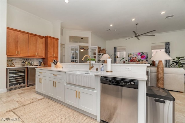 1435 SW 53rd Ln, Cape Coral, FL 33914 - kitchen with ceiling fan, stainless steel dishwasher, a sink, beverage cooler, and open floor plan