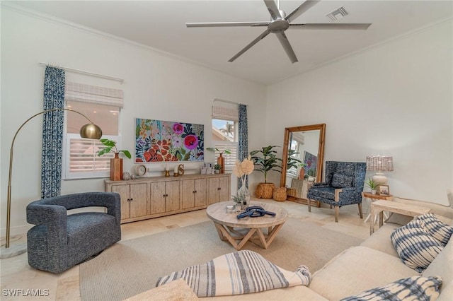 living area with a ceiling fan, visible vents, and crown molding