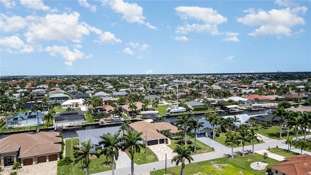 bird's eye view featuring a residential view and a water view