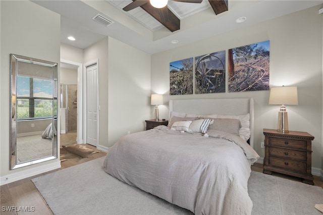 bedroom with ceiling fan, a closet, and wood-type flooring