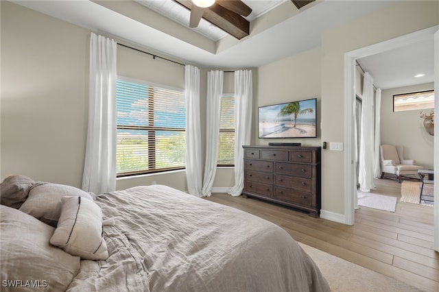 bedroom featuring light hardwood / wood-style flooring and ceiling fan