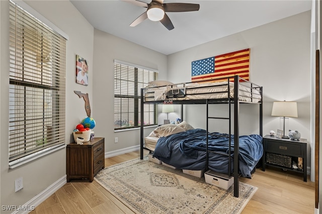 bedroom with light wood-type flooring and ceiling fan