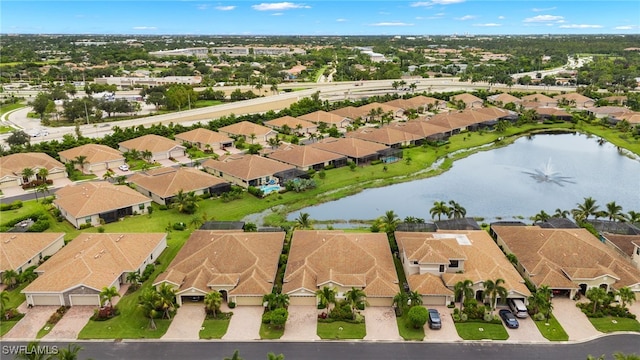 aerial view with a residential view and a water view