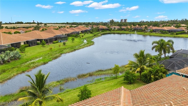 bird's eye view featuring a water view and a residential view