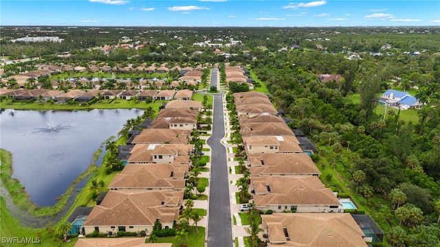 birds eye view of property with a residential view and a water view