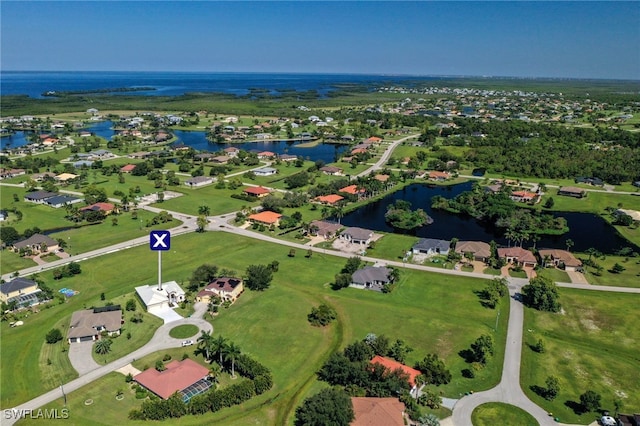 drone / aerial view with a water view