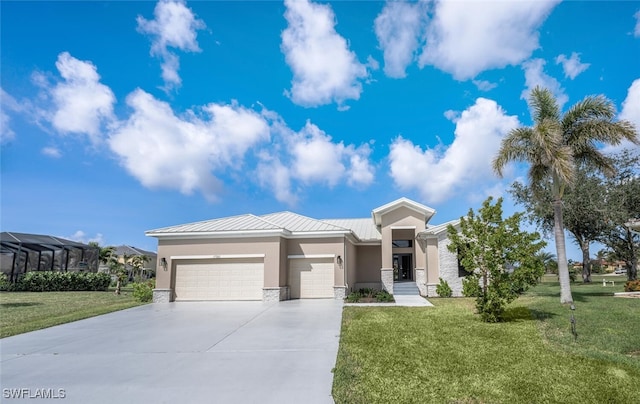 view of front of property featuring a garage and a front lawn