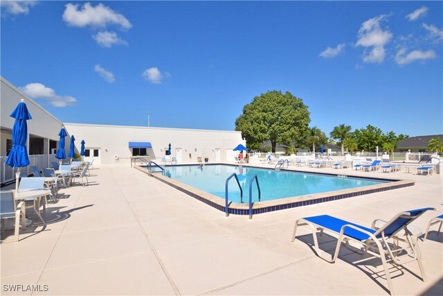 7076 E Brandywine Cir, Fort Myers, FL 33919 - community pool featuring a patio area