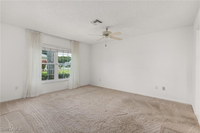 7076 E Brandywine Cir, Fort Myers, FL 33919 - unfurnished room with carpet floors, a ceiling fan, a textured ceiling, and baseboards