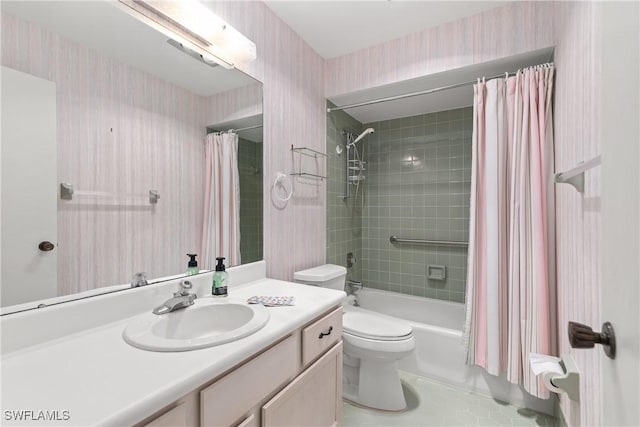 7076 E Brandywine Cir, Fort Myers, FL 33919 - bathroom with wallpapered walls, vanity, toilet, shower / bath combo, and tile patterned flooring