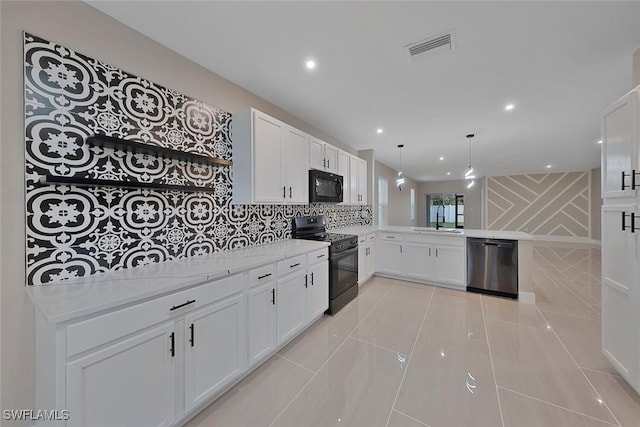 kitchen featuring black appliances, white cabinets, and kitchen peninsula