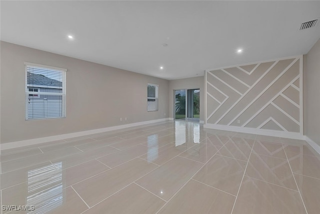 unfurnished living room featuring light tile patterned floors