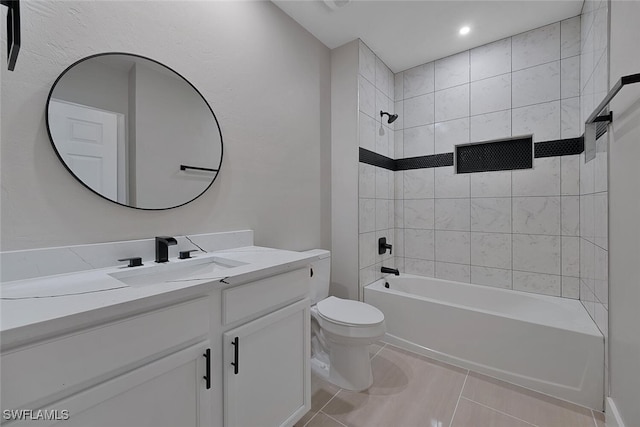 full bathroom with tile patterned floors, vanity, toilet, and tiled shower / bath