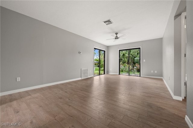 unfurnished room featuring ceiling fan and wood-type flooring