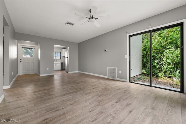 unfurnished living room with light hardwood / wood-style floors and ceiling fan