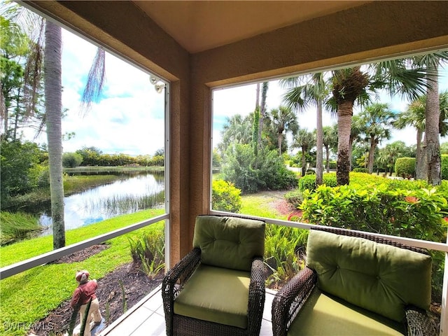 sunroom with a water view