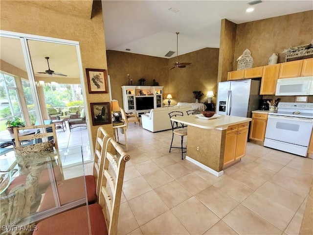 kitchen with high vaulted ceiling, white appliances, open floor plan, and a ceiling fan