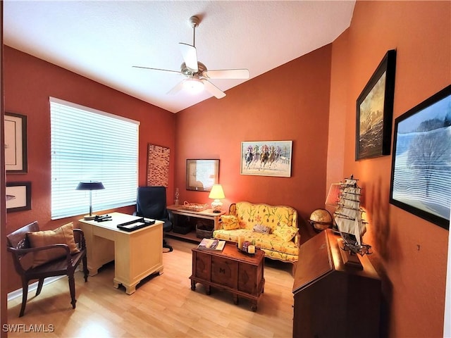 office space with lofted ceiling, light wood finished floors, and a ceiling fan