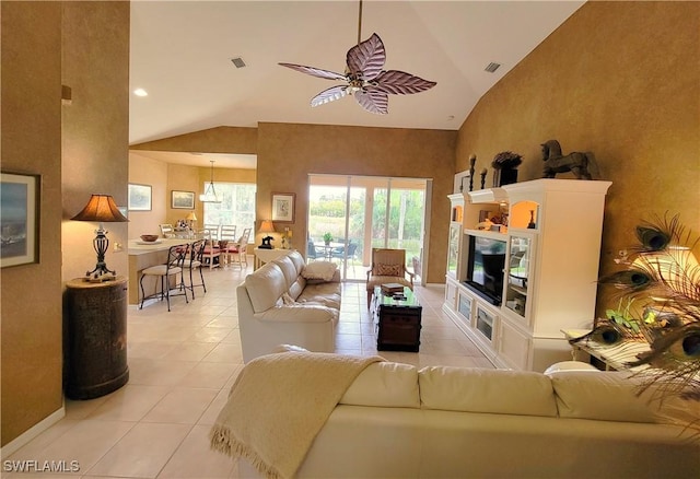 living area featuring high vaulted ceiling, a ceiling fan, visible vents, and light tile patterned floors