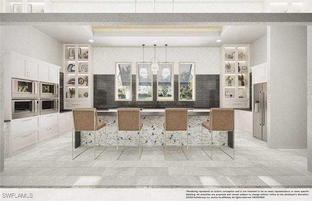 kitchen with white cabinetry, a kitchen bar, a tray ceiling, and pendant lighting