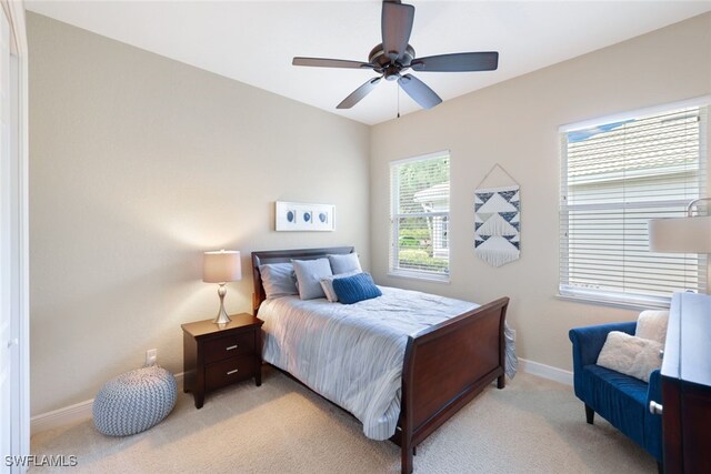 carpeted bedroom featuring ceiling fan