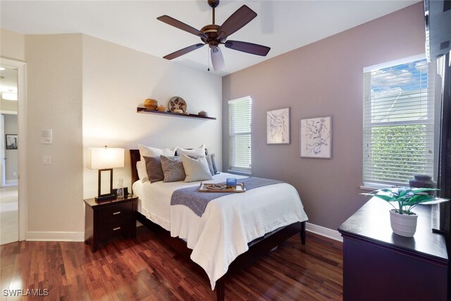 bedroom featuring ceiling fan and dark hardwood / wood-style flooring