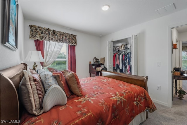 carpeted bedroom with a closet