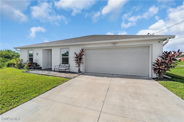 single story home with a garage and a front yard