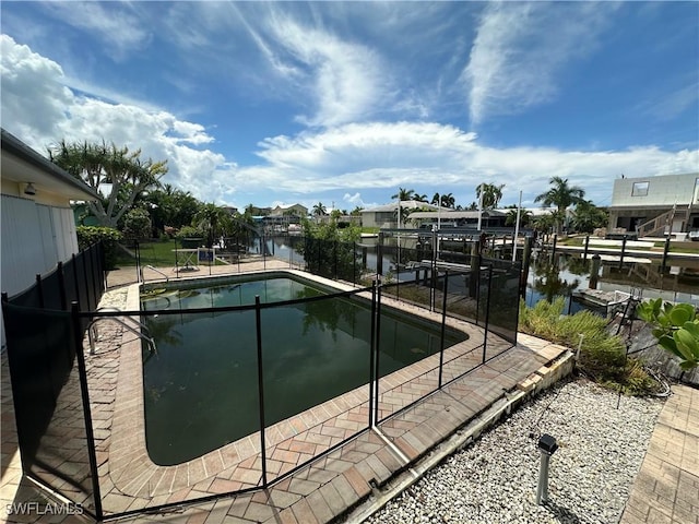 view of pool featuring a water view