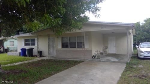 view of front of property with a carport