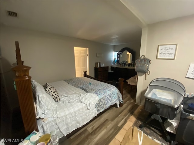 bedroom with hardwood / wood-style floors