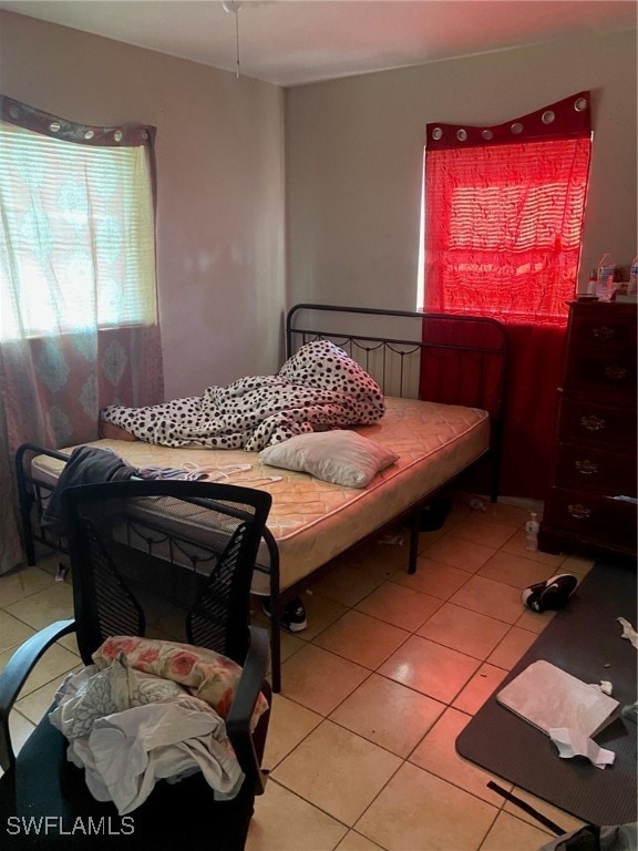 bedroom featuring light tile patterned floors