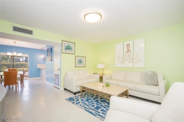 living room with a notable chandelier