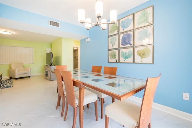 dining area featuring an inviting chandelier