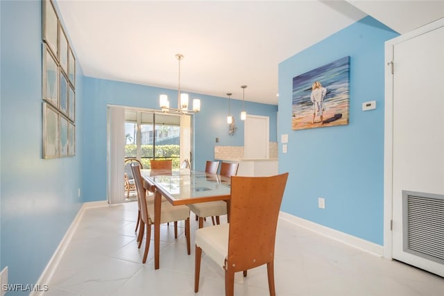 dining space featuring a chandelier