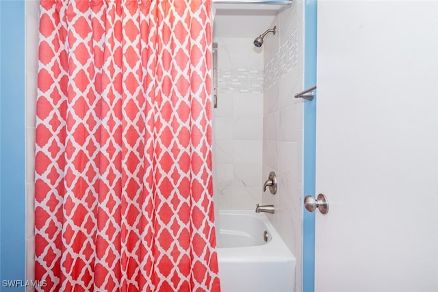 bathroom with shower / bath combination with curtain