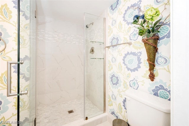 bathroom featuring an enclosed shower and toilet