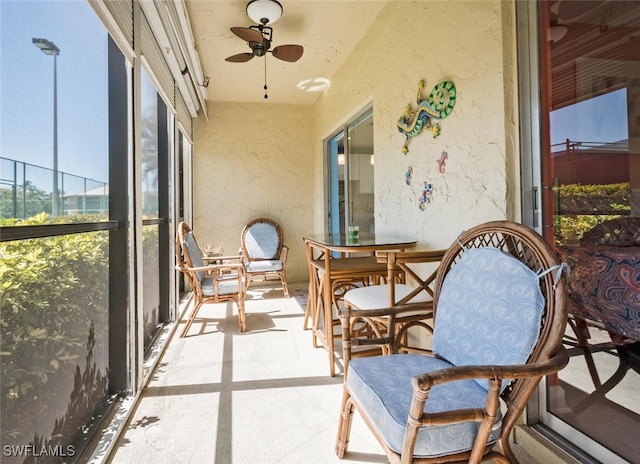 sunroom / solarium with ceiling fan