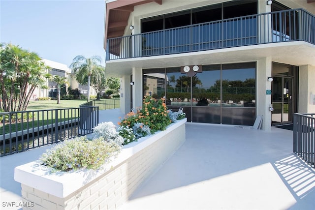 view of patio with a balcony