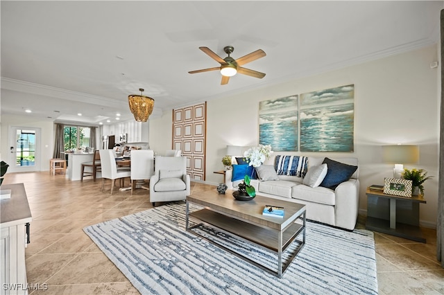 tiled living room featuring ceiling fan with notable chandelier and ornamental molding