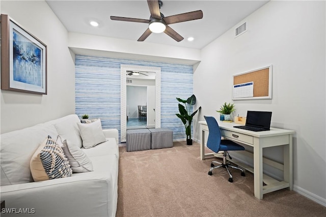 carpeted home office with ceiling fan, recessed lighting, an accent wall, visible vents, and baseboards