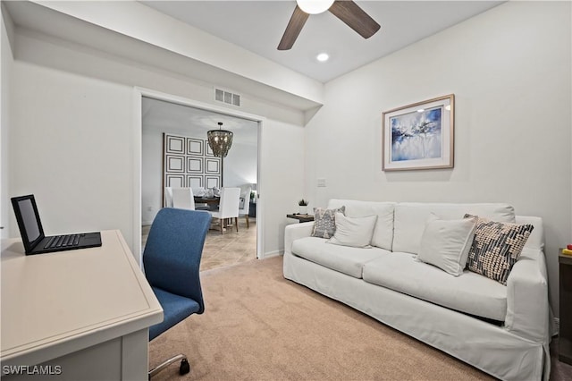 office space with a ceiling fan, recessed lighting, visible vents, and light carpet