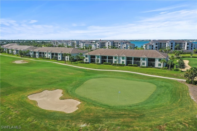 surrounding community featuring a water view and a yard